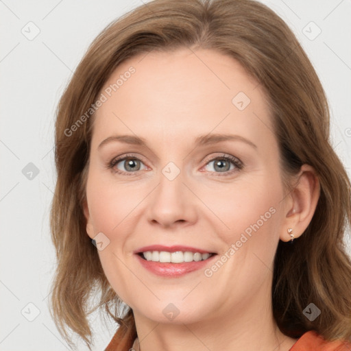 Joyful white young-adult female with medium  brown hair and blue eyes