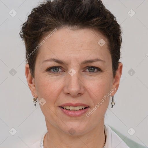 Joyful white adult female with short  brown hair and grey eyes