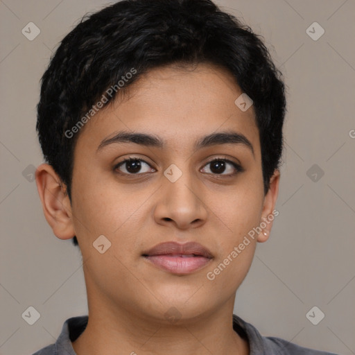 Joyful latino young-adult female with short  brown hair and brown eyes