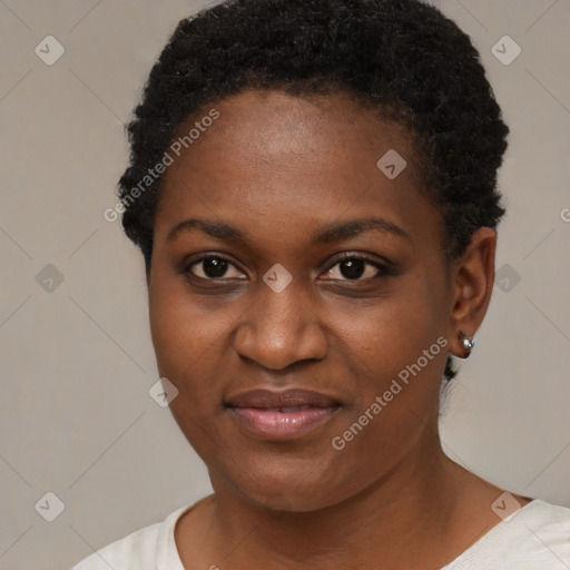 Joyful black young-adult female with short  black hair and brown eyes