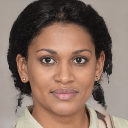 Joyful black young-adult female with medium  brown hair and brown eyes