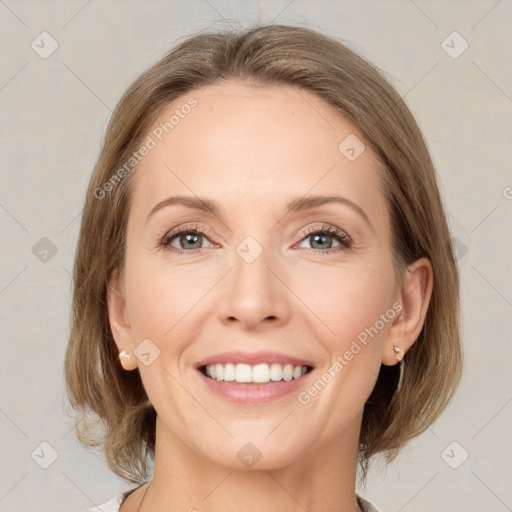 Joyful white young-adult female with medium  brown hair and grey eyes