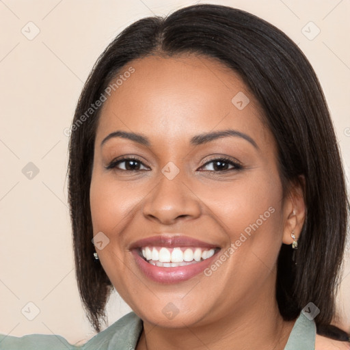 Joyful latino young-adult female with medium  brown hair and brown eyes