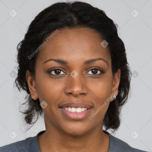 Joyful black young-adult female with long  brown hair and brown eyes