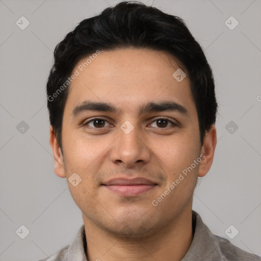 Joyful latino young-adult male with short  black hair and brown eyes