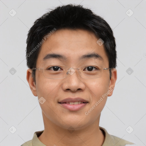 Joyful asian young-adult male with short  brown hair and brown eyes