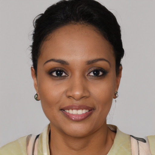 Joyful latino young-adult female with short  brown hair and brown eyes
