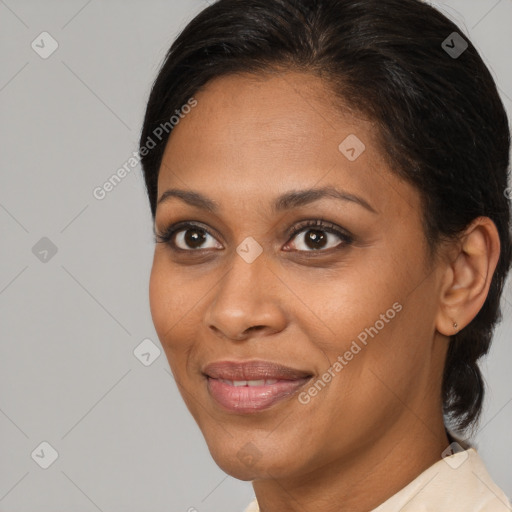 Joyful black young-adult female with medium  brown hair and brown eyes