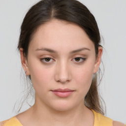 Neutral white young-adult female with medium  brown hair and brown eyes