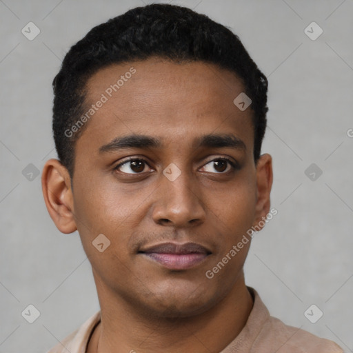 Joyful black young-adult male with short  black hair and brown eyes