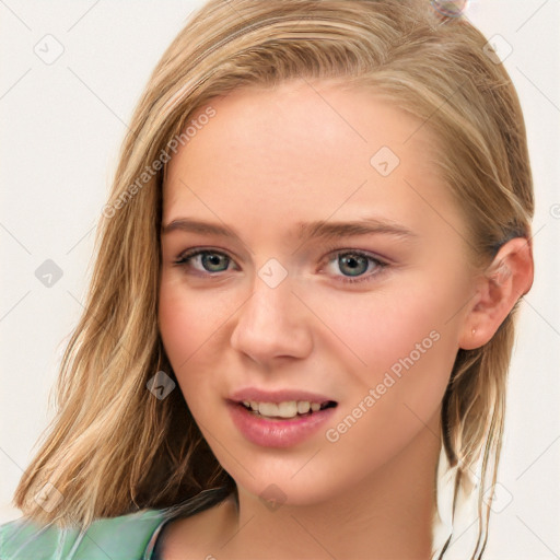 Joyful white young-adult female with long  brown hair and blue eyes