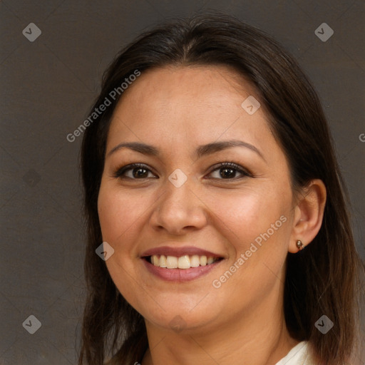 Joyful white adult female with long  brown hair and brown eyes