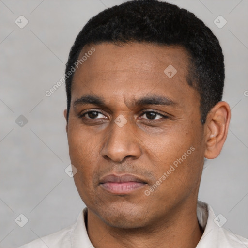 Neutral latino young-adult male with short  black hair and brown eyes