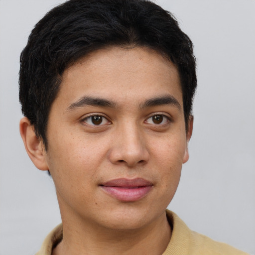 Joyful latino young-adult male with short  brown hair and brown eyes