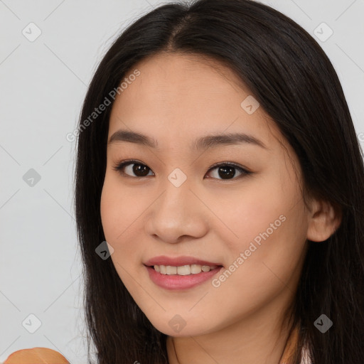 Joyful asian young-adult female with long  brown hair and brown eyes