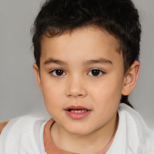 Joyful white child male with short  brown hair and brown eyes