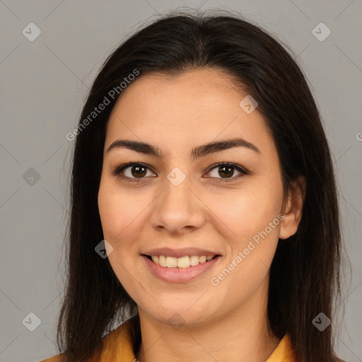 Joyful latino young-adult female with long  brown hair and brown eyes