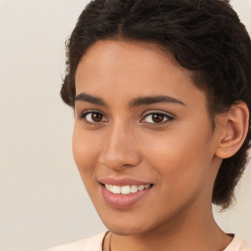 Joyful white young-adult female with long  brown hair and brown eyes