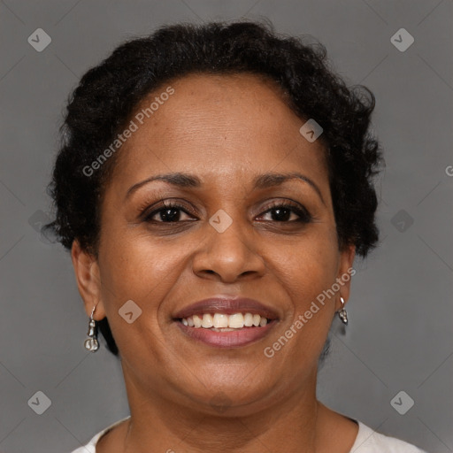 Joyful black adult female with short  brown hair and brown eyes