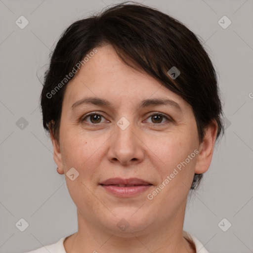 Joyful white adult female with short  brown hair and brown eyes