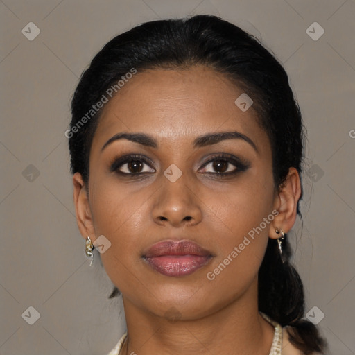 Joyful black young-adult female with medium  black hair and brown eyes