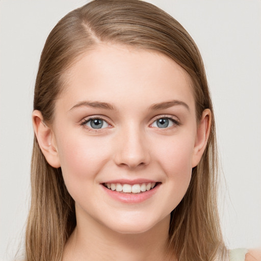 Joyful white young-adult female with long  brown hair and blue eyes