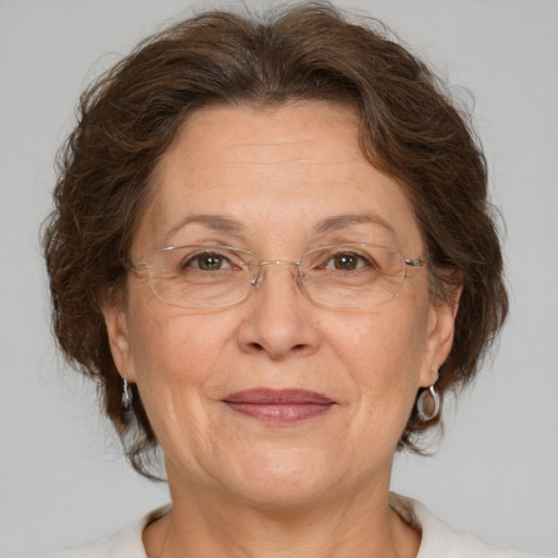 Joyful white middle-aged female with medium  brown hair and brown eyes