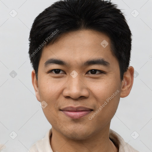 Joyful asian young-adult male with short  black hair and brown eyes