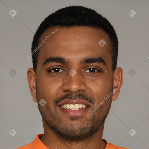 Joyful black young-adult male with short  black hair and brown eyes
