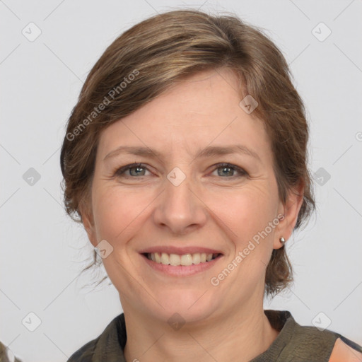 Joyful white adult female with medium  brown hair and grey eyes