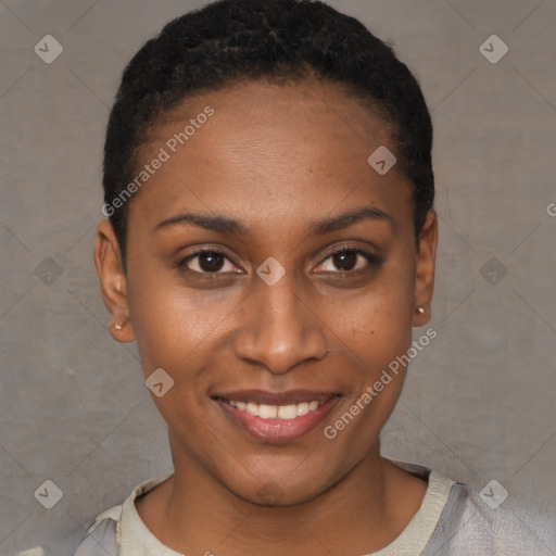 Joyful black young-adult female with short  black hair and brown eyes