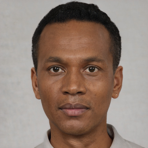Neutral black young-adult male with short  black hair and brown eyes