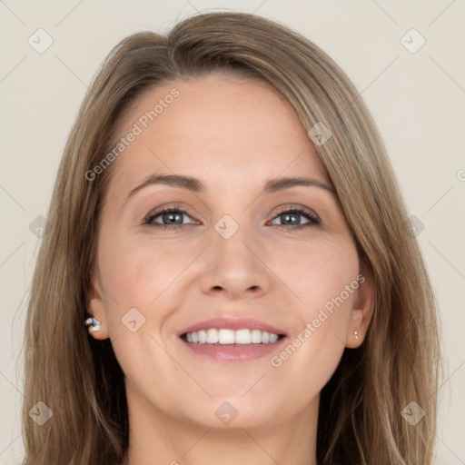 Joyful white young-adult female with long  brown hair and grey eyes