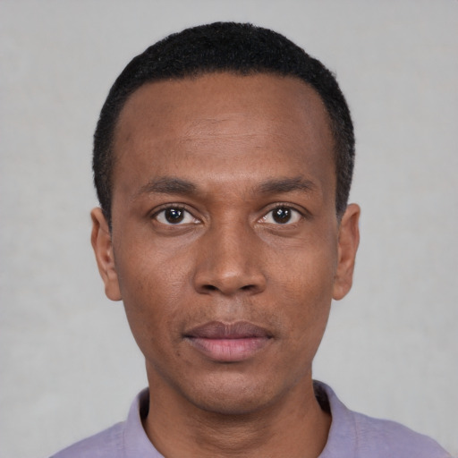 Neutral black young-adult male with short  black hair and brown eyes
