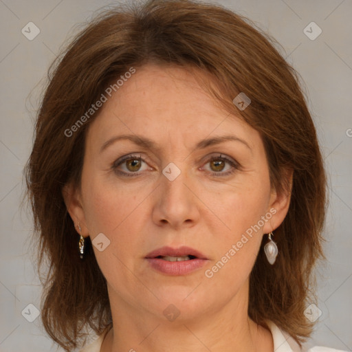 Joyful white adult female with medium  brown hair and grey eyes