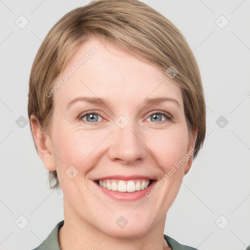 Joyful white young-adult female with medium  brown hair and blue eyes