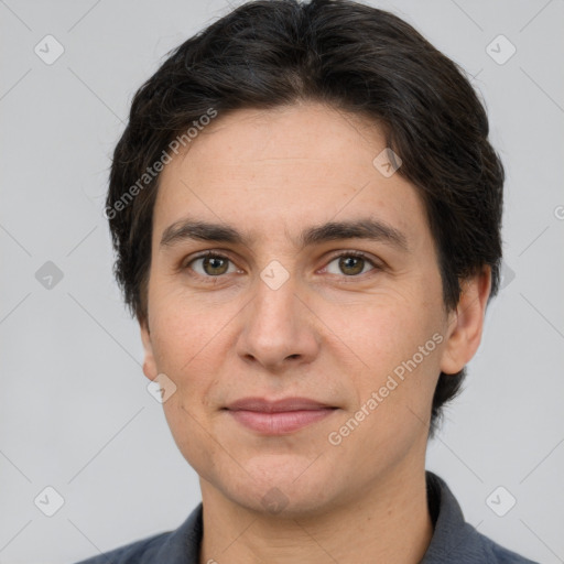 Joyful white adult male with short  brown hair and brown eyes