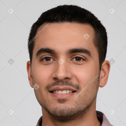 Joyful white young-adult male with short  black hair and brown eyes