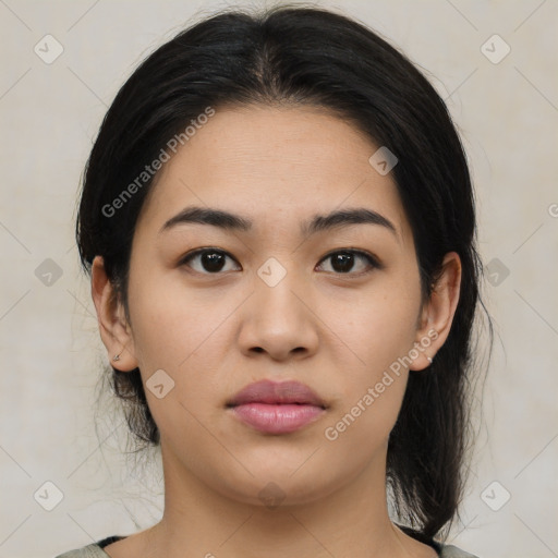 Joyful latino young-adult female with medium  brown hair and brown eyes