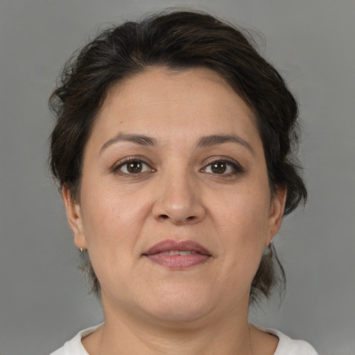 Joyful white adult female with medium  brown hair and brown eyes