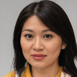 Joyful asian young-adult female with medium  brown hair and brown eyes