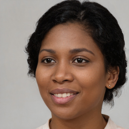 Joyful latino young-adult female with medium  black hair and brown eyes