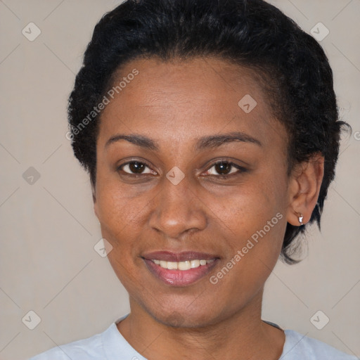 Joyful black young-adult female with short  black hair and brown eyes