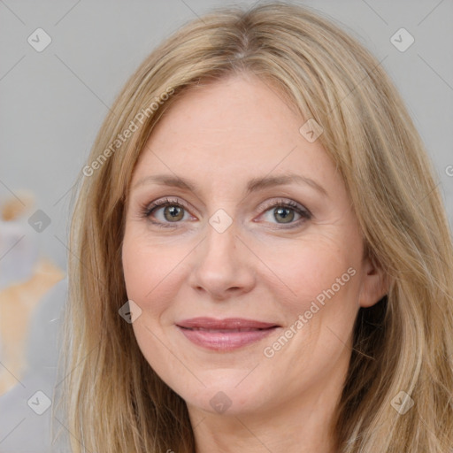 Joyful white adult female with long  brown hair and brown eyes