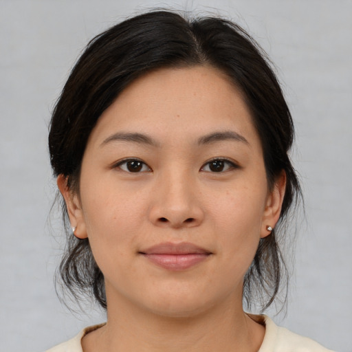 Neutral asian young-adult female with medium  brown hair and brown eyes