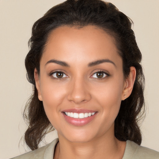 Joyful white young-adult female with medium  brown hair and brown eyes