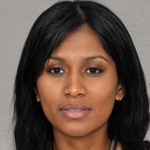 Joyful asian young-adult female with long  black hair and brown eyes