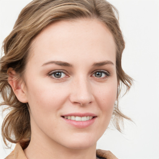 Joyful white young-adult female with medium  brown hair and blue eyes