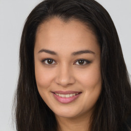 Joyful asian young-adult female with long  brown hair and brown eyes