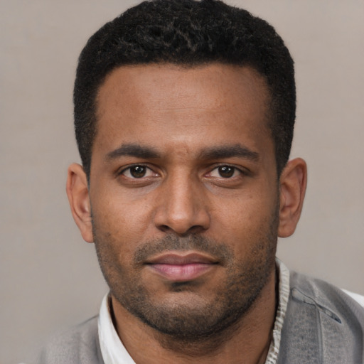 Neutral latino young-adult male with short  black hair and brown eyes
